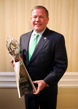 University of Notre Dame head coach Brian Kelly received last year's Liberty Mutual Coach of the Year Award at the FBS level, receiving a $70,000 in donations for charity and scholarship