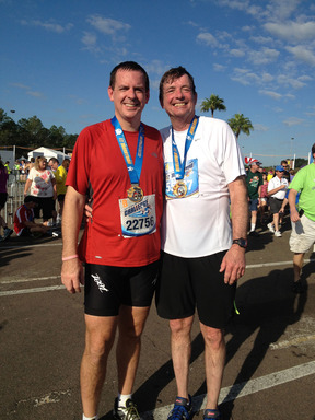 Doug Olson (at right following his first half marathon in 2012), was the third patient in the world to receive a personalized therapy for his leukemia. He has been in remission for more than 3 years.