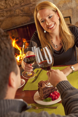 A couple dines fireside at one of Door County's cozy restaurants during the annual Nature of Romance promotion in Door County, Wisconsin. Photo courtesy Mike Roemer/DoorCounty.com.