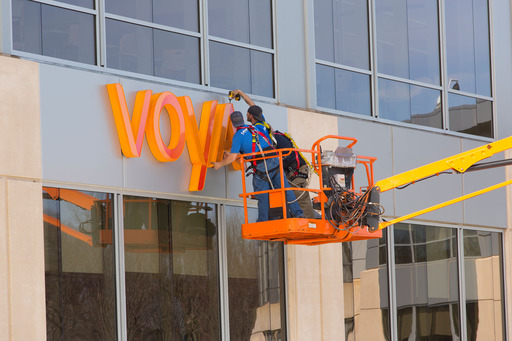 A new Voya sign is installed on the company’s building in Windsor, Conn. ING U.S. changed its corporate name to Voya Financial on April 7 as part of a phased rebranding effort. 