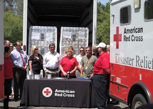 World Grocer donates Canned Emergency drinking water to Red Cross