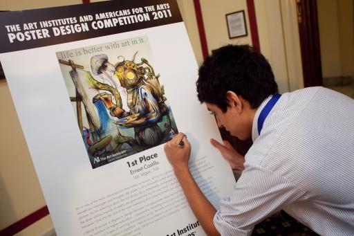 2011 Poster Design Competition Grand Prize Winner Signing His Poster