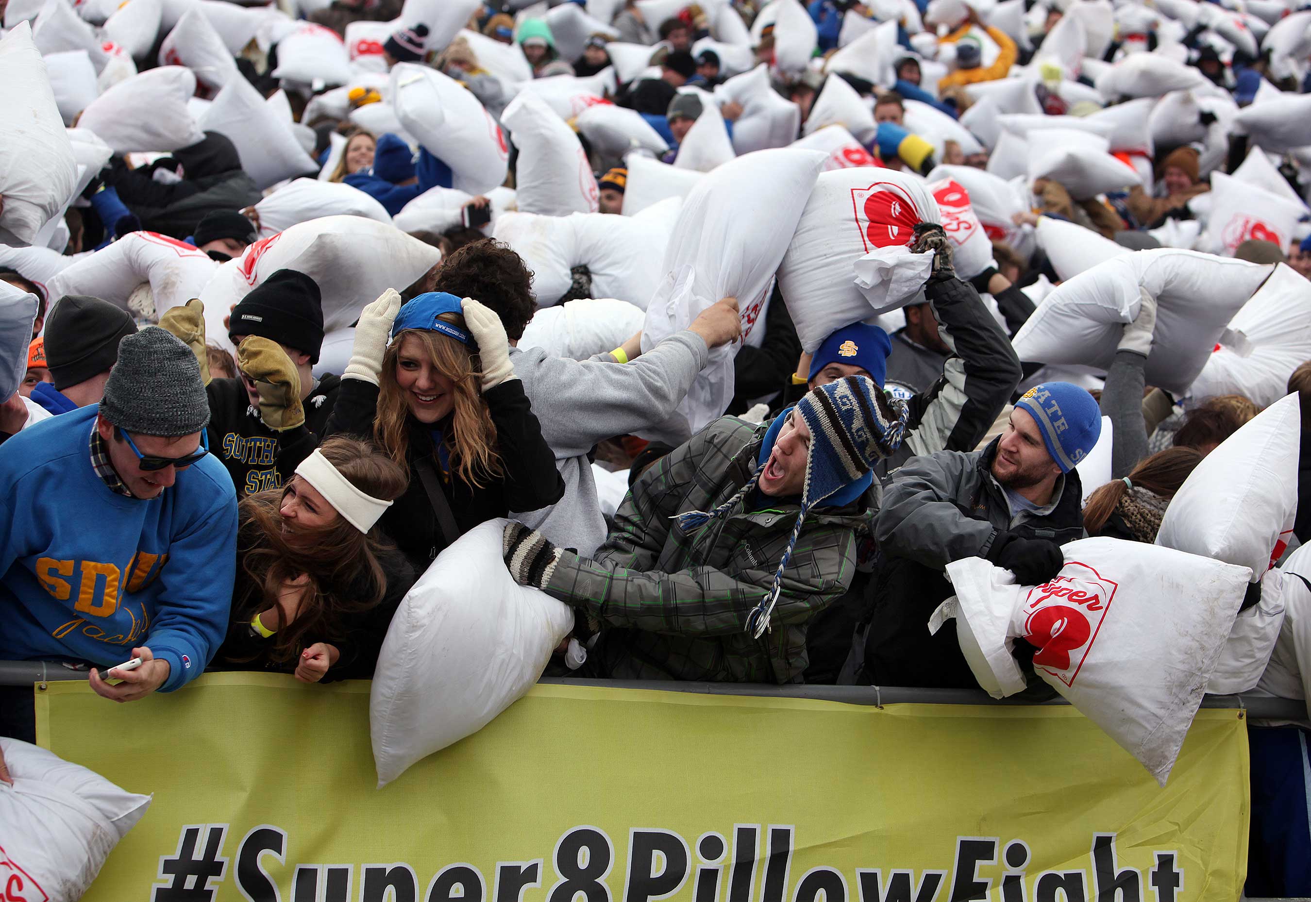  South Dakota State University students and fans participate in pillow fight to break the Guinness World Record for the largest pillow fight. (Photo by Jay Pickthorn/Invision for Super 8) 
