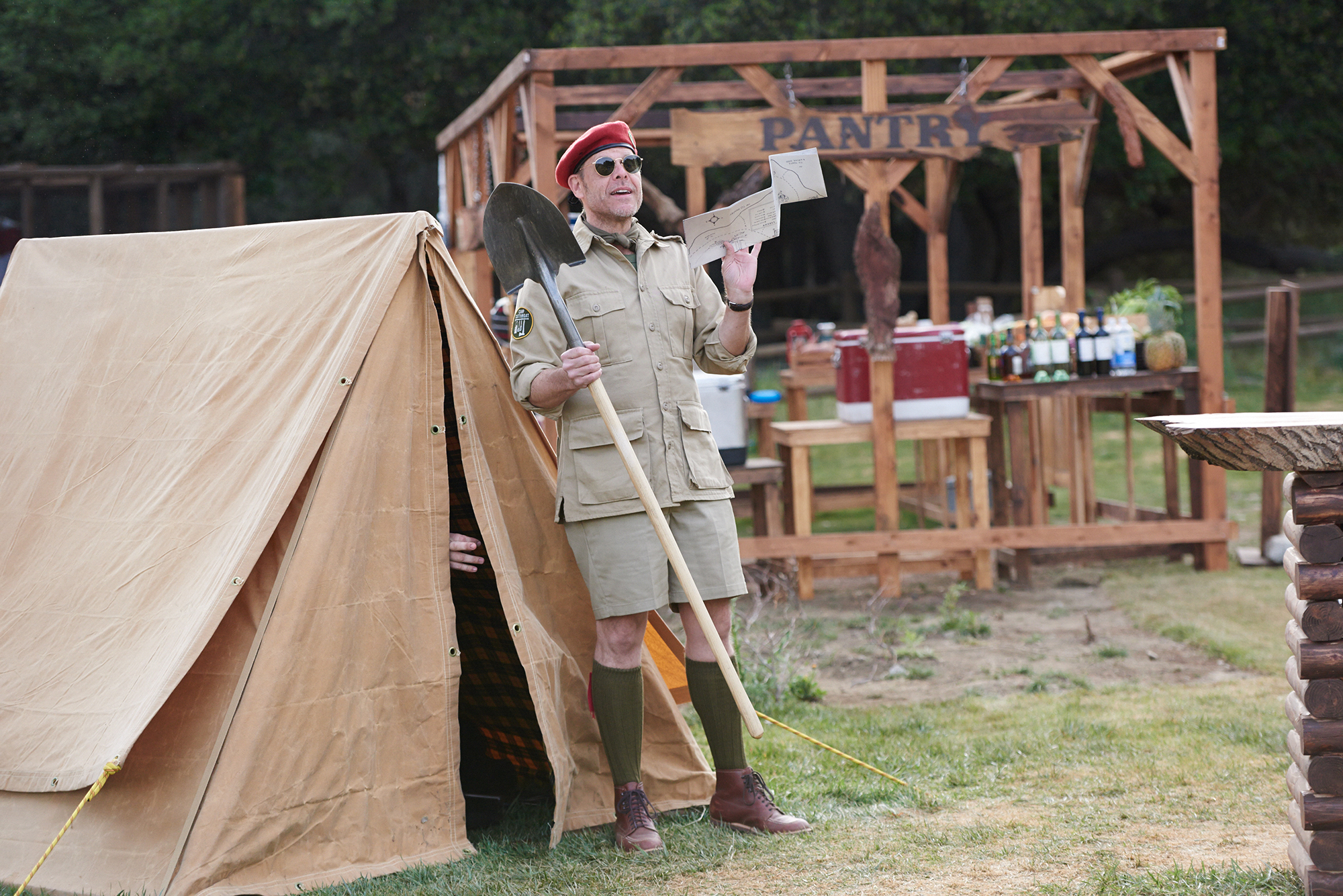 Host Alton Brown explains a challenge on Food Network's Camp Cutthroat
