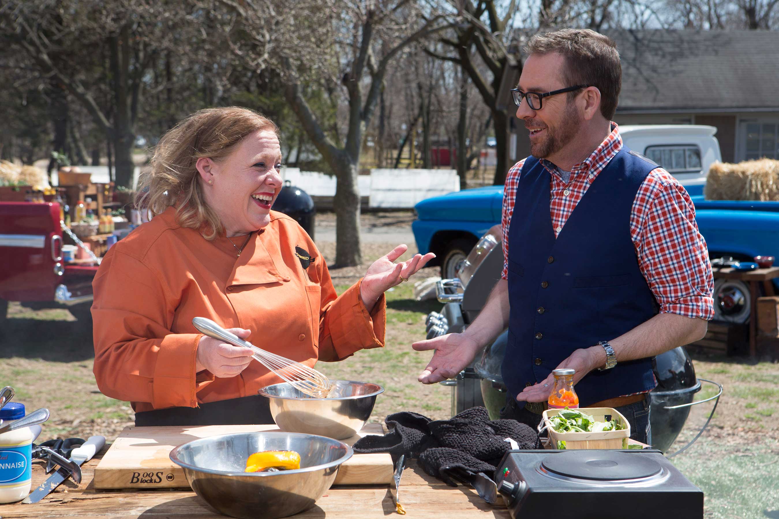 Host Ted Allen with a Contestant on Food Network's Chopped Grill Masters 