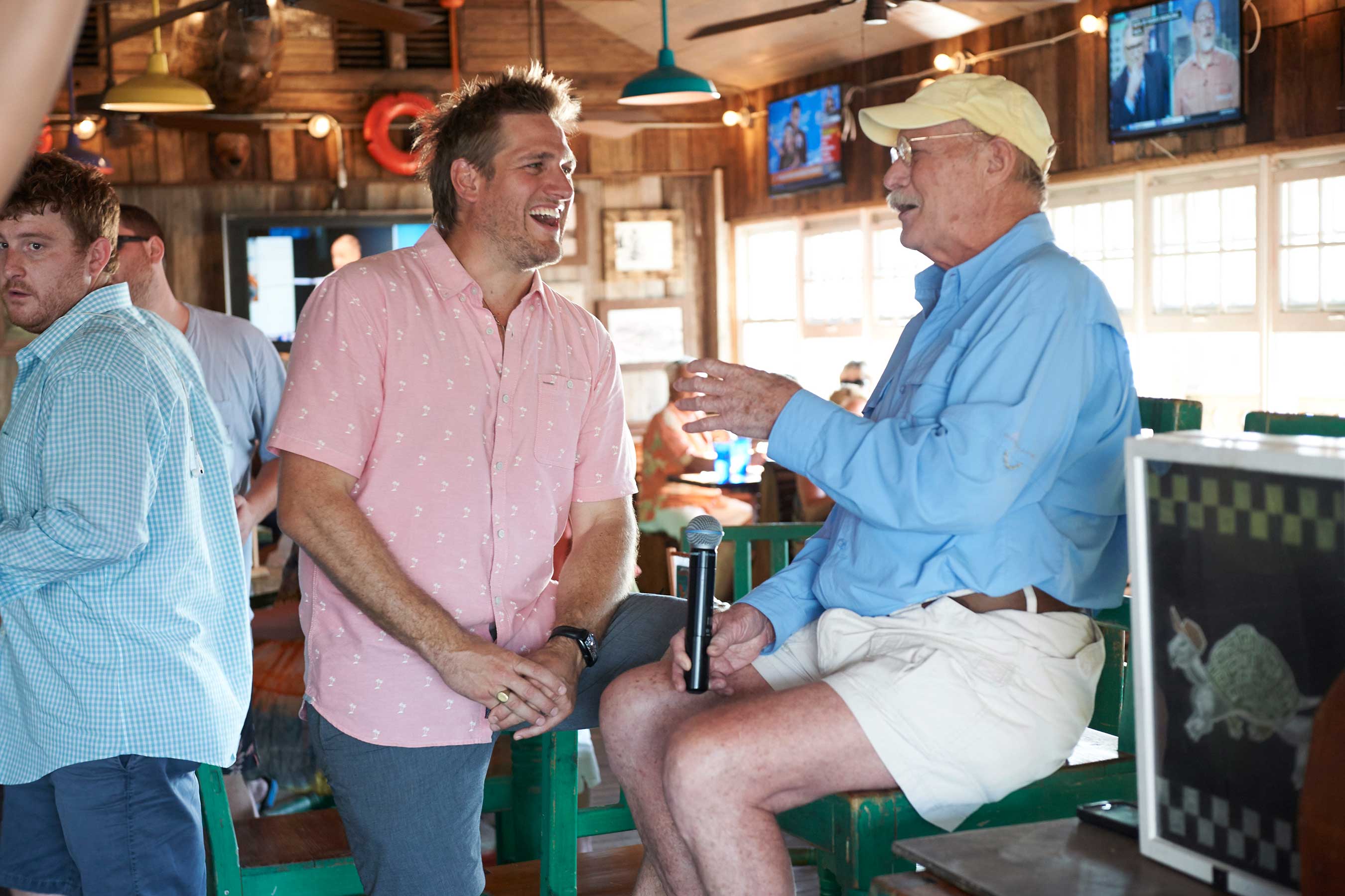 Host Curtis Stone chats with guests at Turtle Kraals on Food Network's Beach Eats
