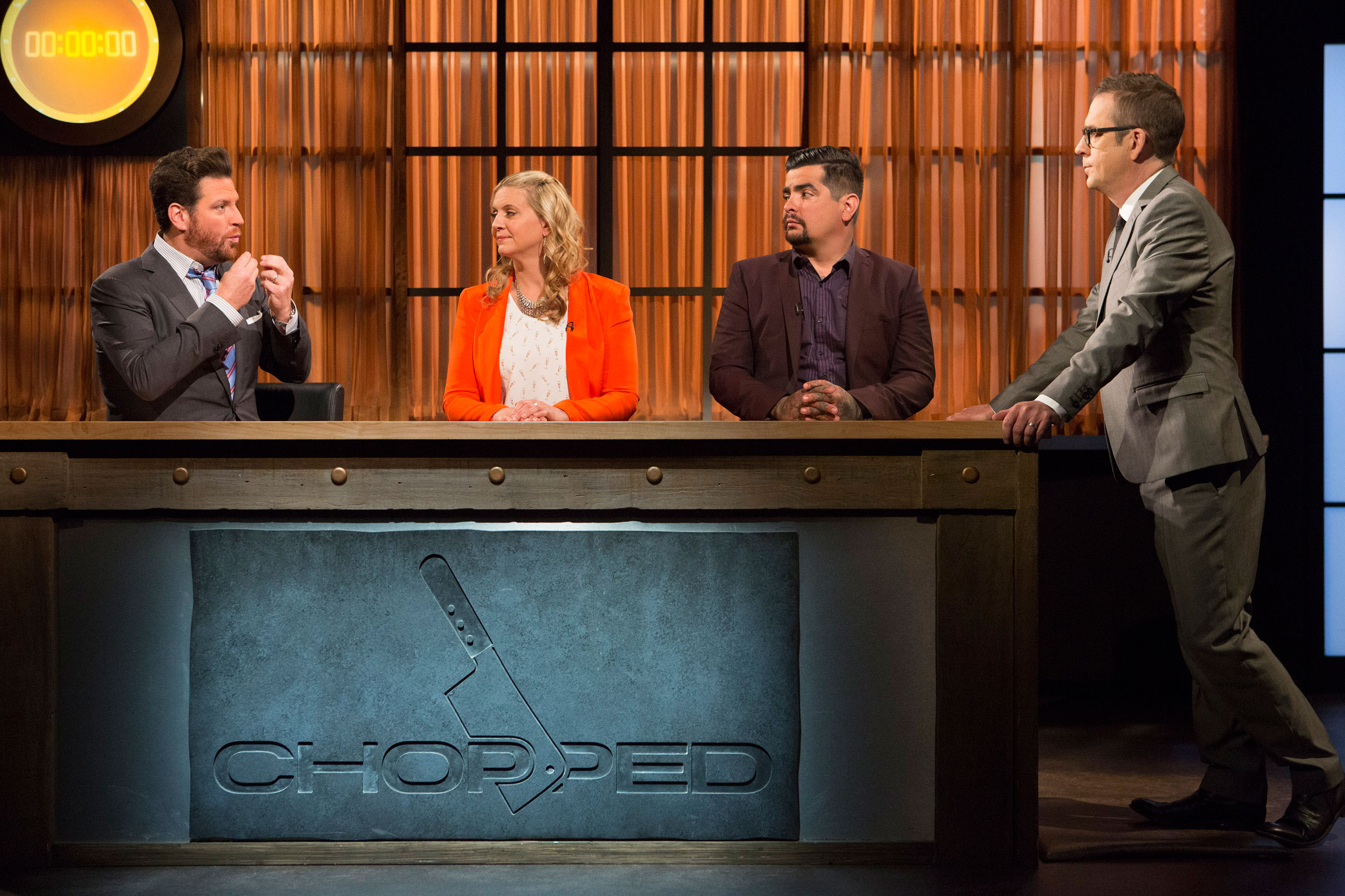 Judges Scott Conant, Amanda Freitag and Aaron Sanchez with host Ted Allen on Food Network's Chopped: Impossible