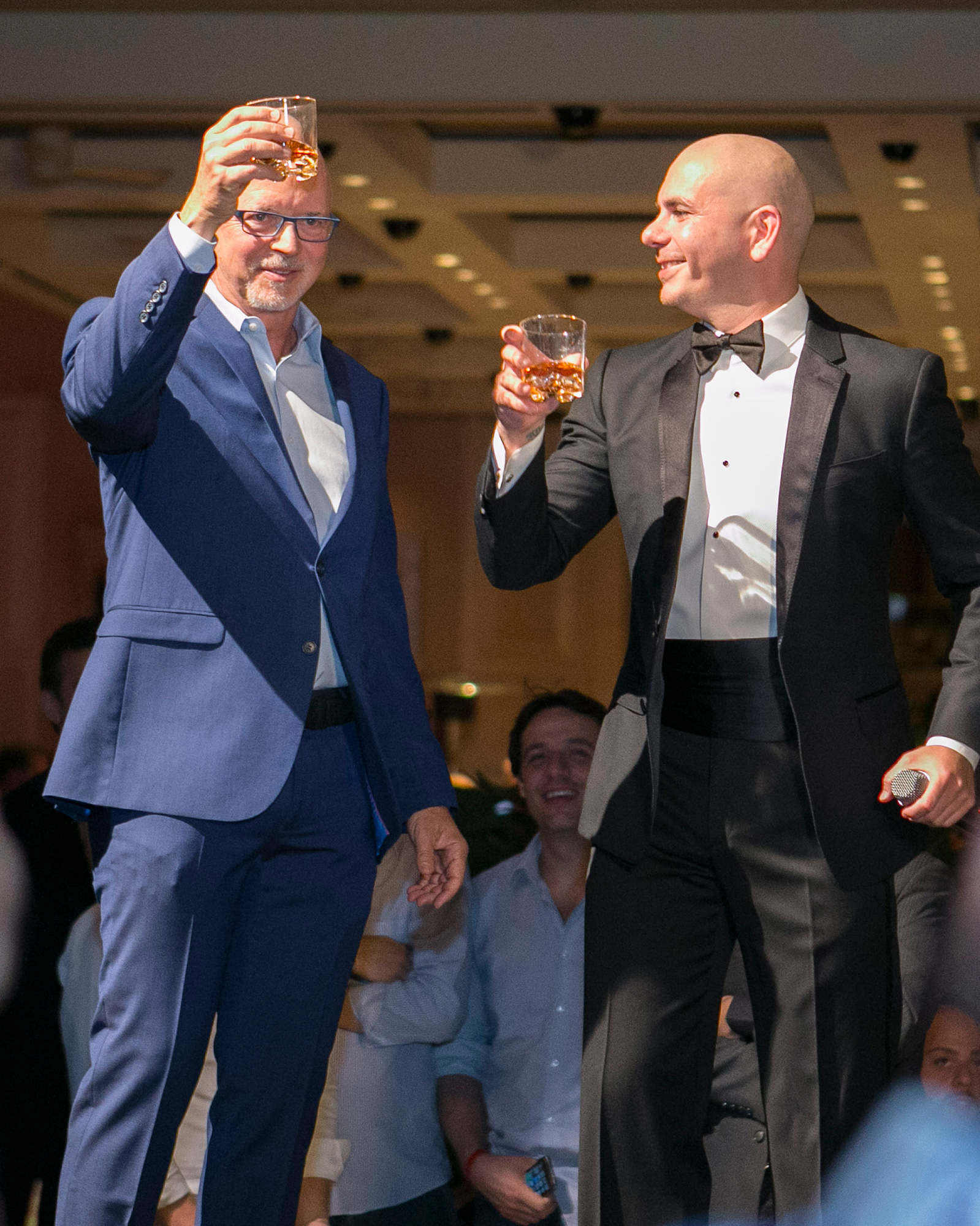 Bally Technologies CEO Richard Haddrill and Pitbull – Playboy’s brand ambassador – celebrate during a Global Gaming Expo private event to kick off Bally’s expanded relationship with Playboy.