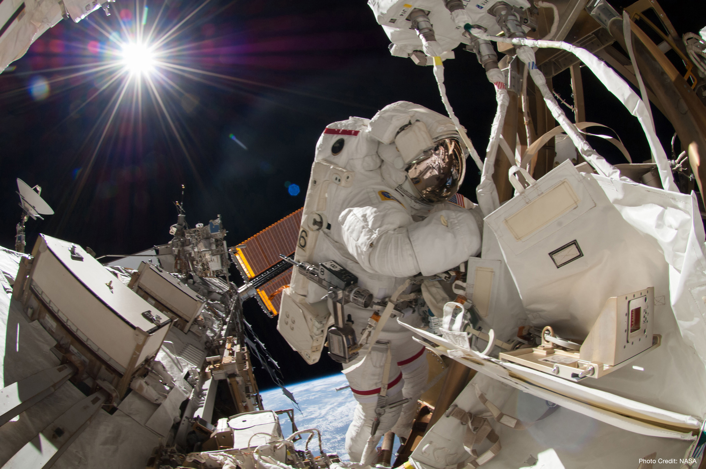 NASA astronaut Reid Wiseman, Expedition 41 flight engineer, participates in a spacewalk, performing maintenance on the International Space Station. Photo credit: NASA.