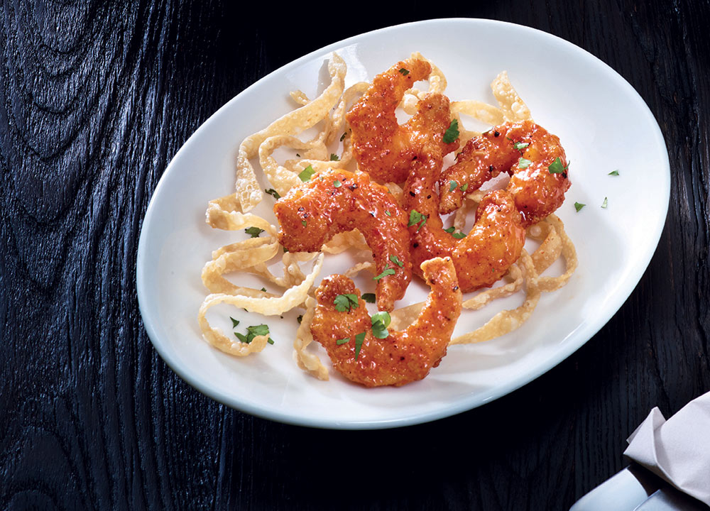 The Sriracha Shrimp features high quality shrimp, fried with Applebee's special coating, which provides a light, flaky crunch, then tossed in a Sriracha Chile Lime sauce.