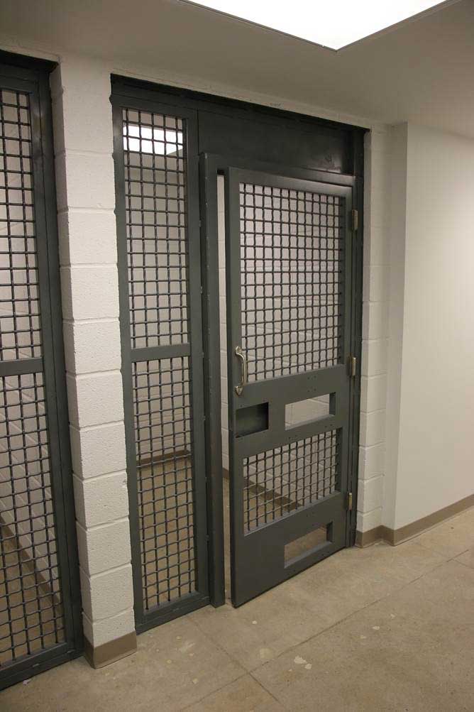 The jail cell where suspects are held for arrest processing before being moved to central booking to await arraignment. Alleged offenders are brought into the facility through a separate entrance so that they never have to interact with their victims.