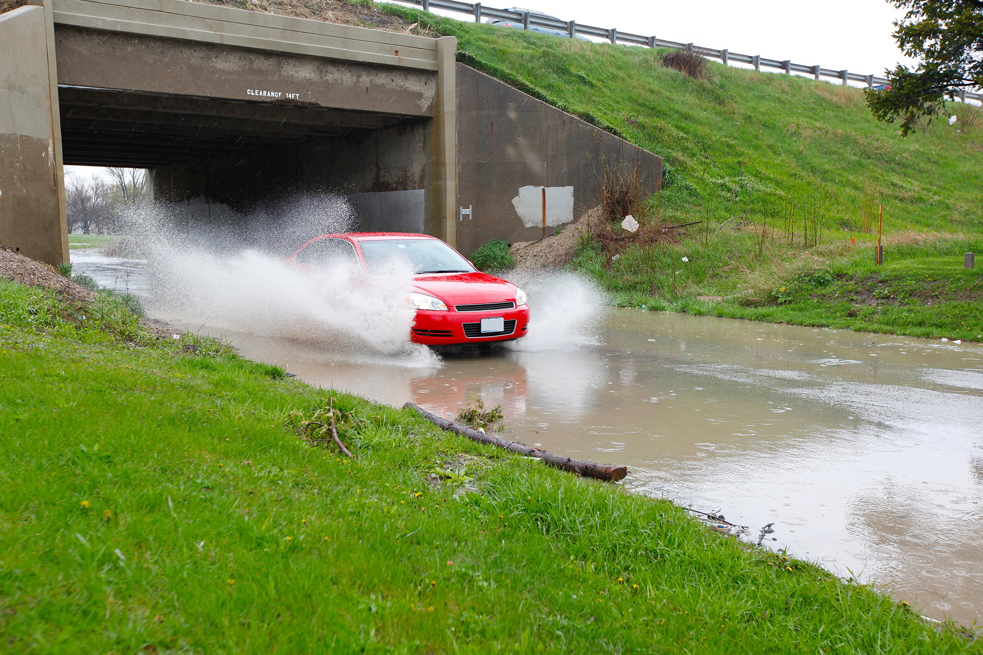 Car approaching high water with splashing