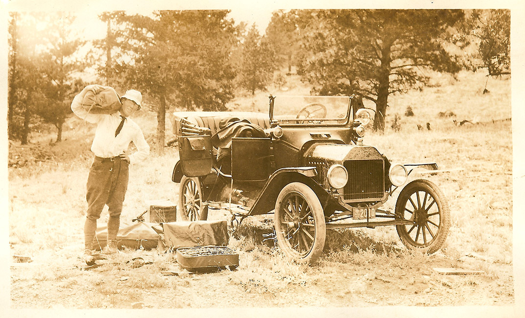 Thomas C. Whitehead empties the Ford Model T. Edsel's diary note: "Took one hour to go first four miles up long steep hill. Had to remove all superfluous weight from car such as cushions, tent, baggage and tools. Had to carry then up by hand." (Photo: AACA Library/Historic Vehicle Association)