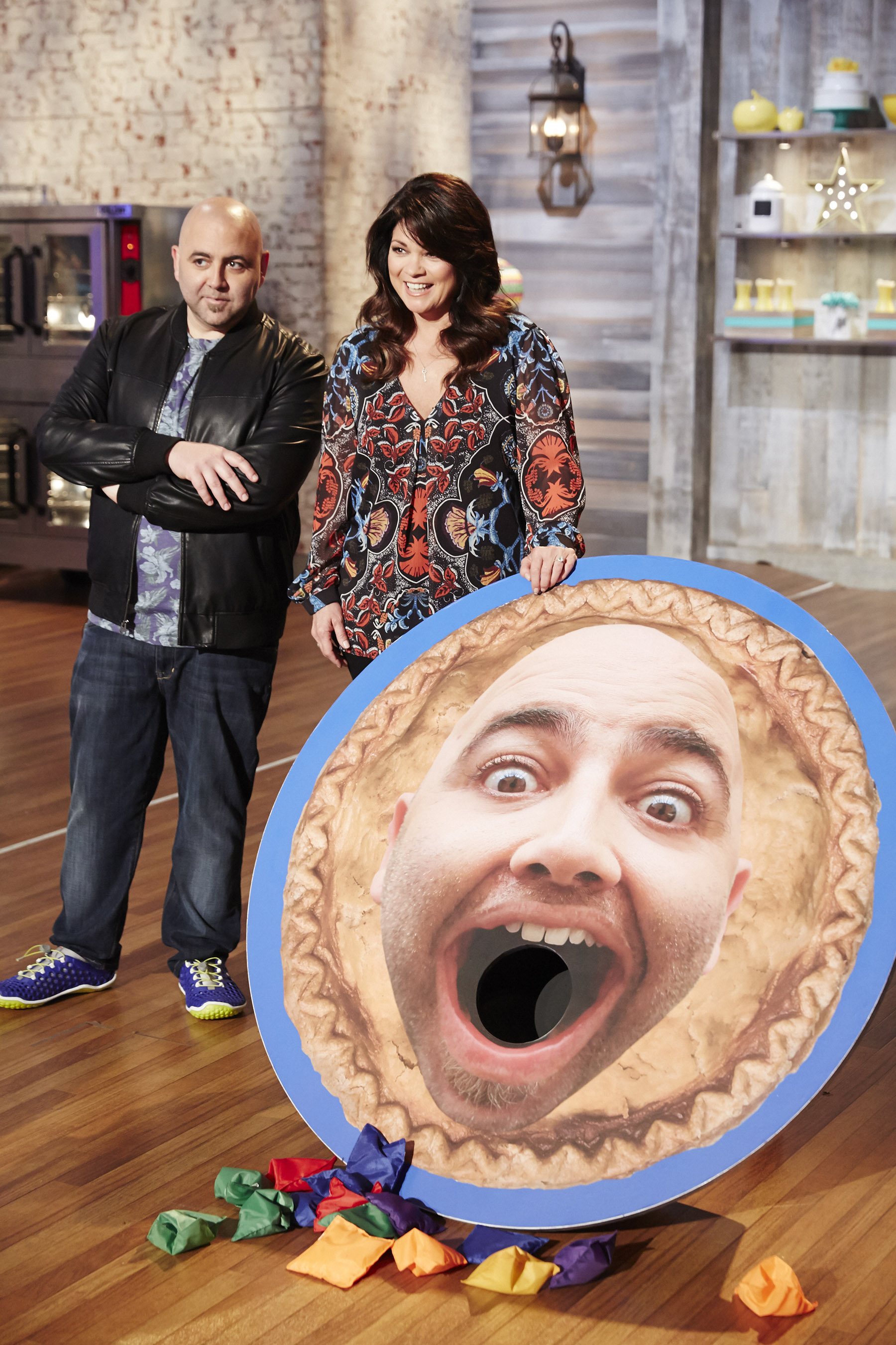 Hosts Duff Goldman and Valerie Bertinelli share a challenge on Food Network's Kids Baking Championship