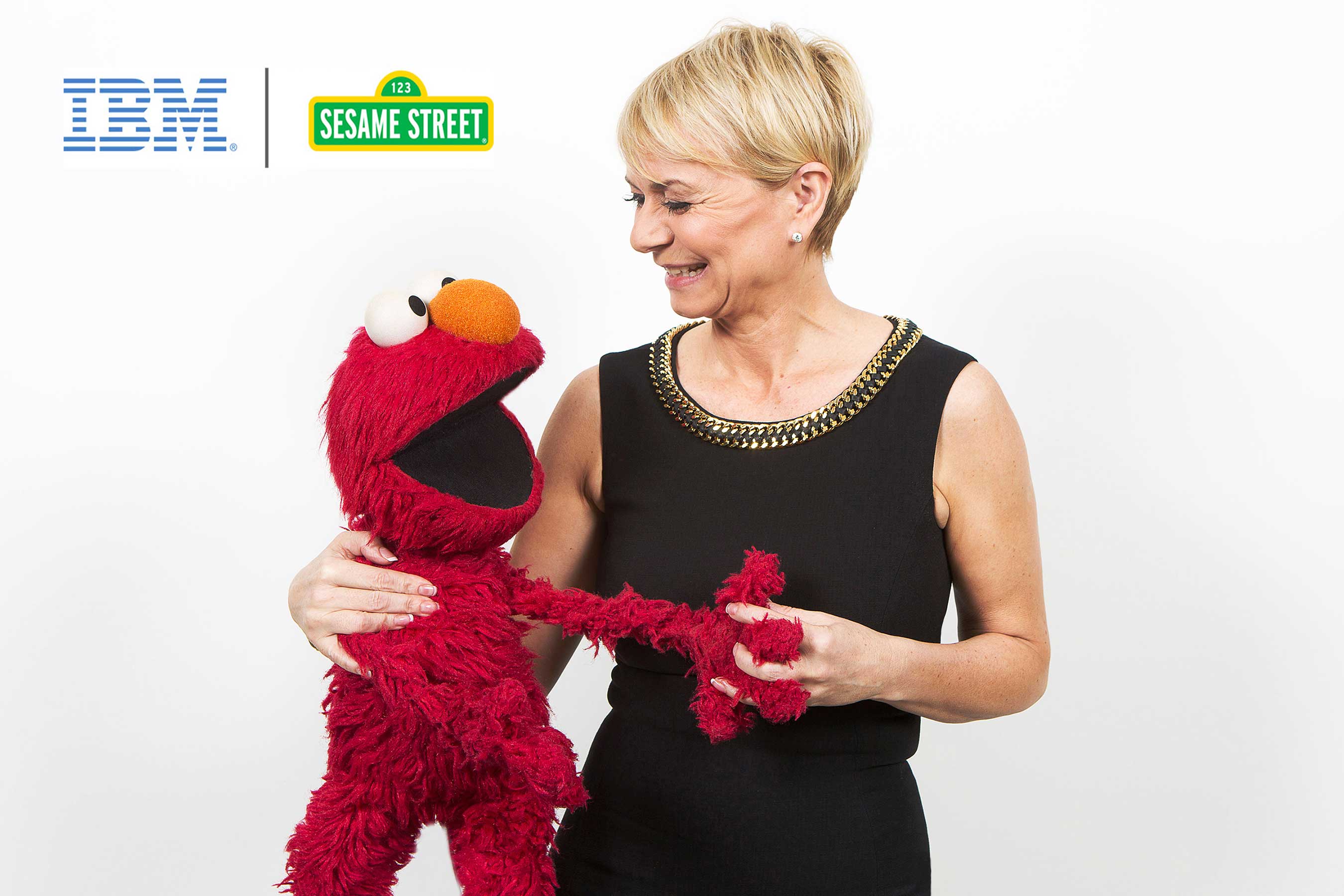 Sesame Workshop and IBM are collaborating to combine IBM Watson's cognitive computing technology and Sesame's early childhood expertise. Together, they hope to advance early childhood education and learning. In this picture, Elmo and Harriet Green, IBM General Manager of Watson Internet of Things, Commerce and Education, enjoy each other’s company. (John O'Boyle, Feature Photo Service for IBM)