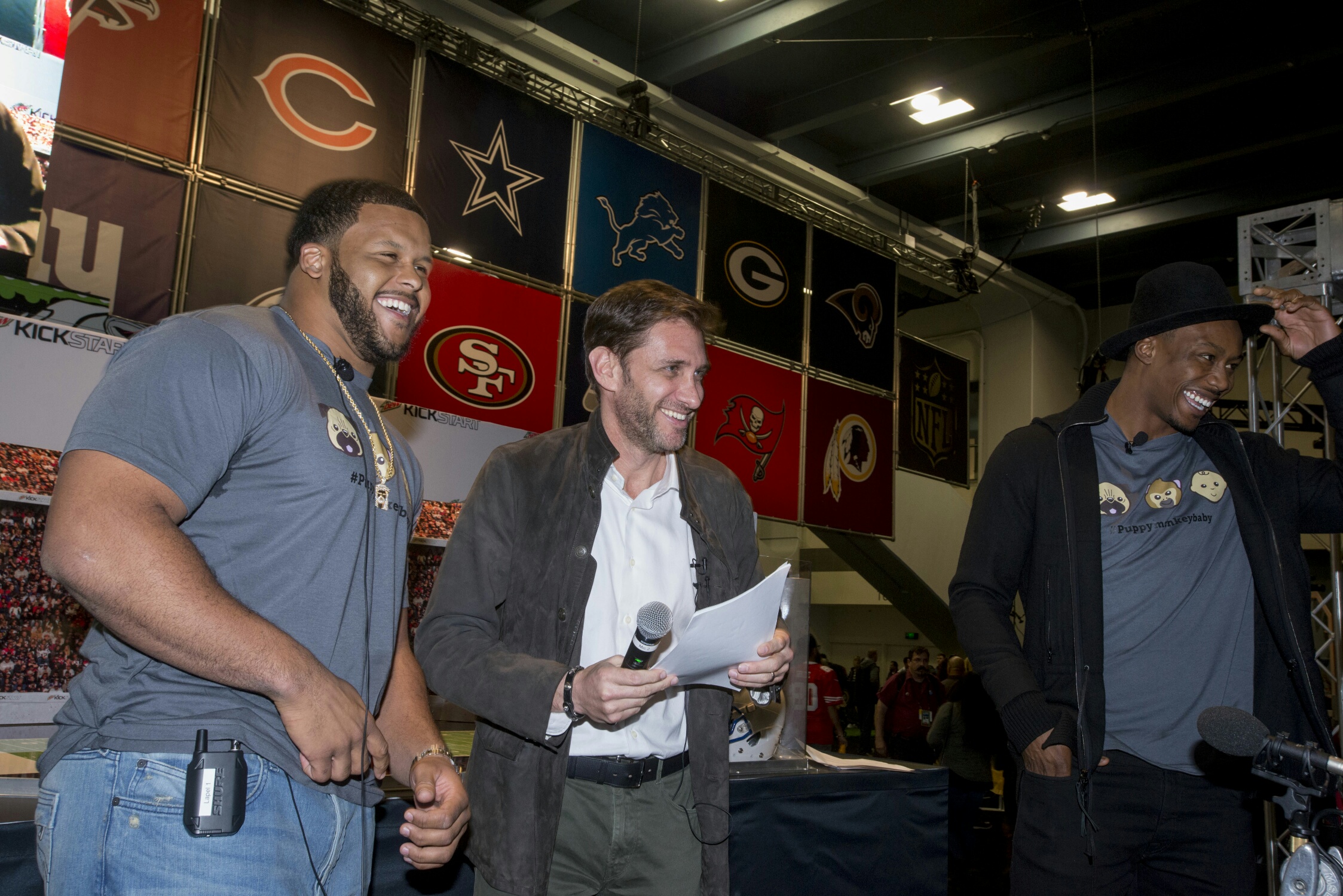 Pro wide receiver Brandon Marshall, pro defensive tackle Aaron Donald and radio personality Mike Greenberg, host the MTN DEW® KICKSTART™ Super Bowl 50 predictions by a puppy, a monkey and a baby at the NFL Experience.