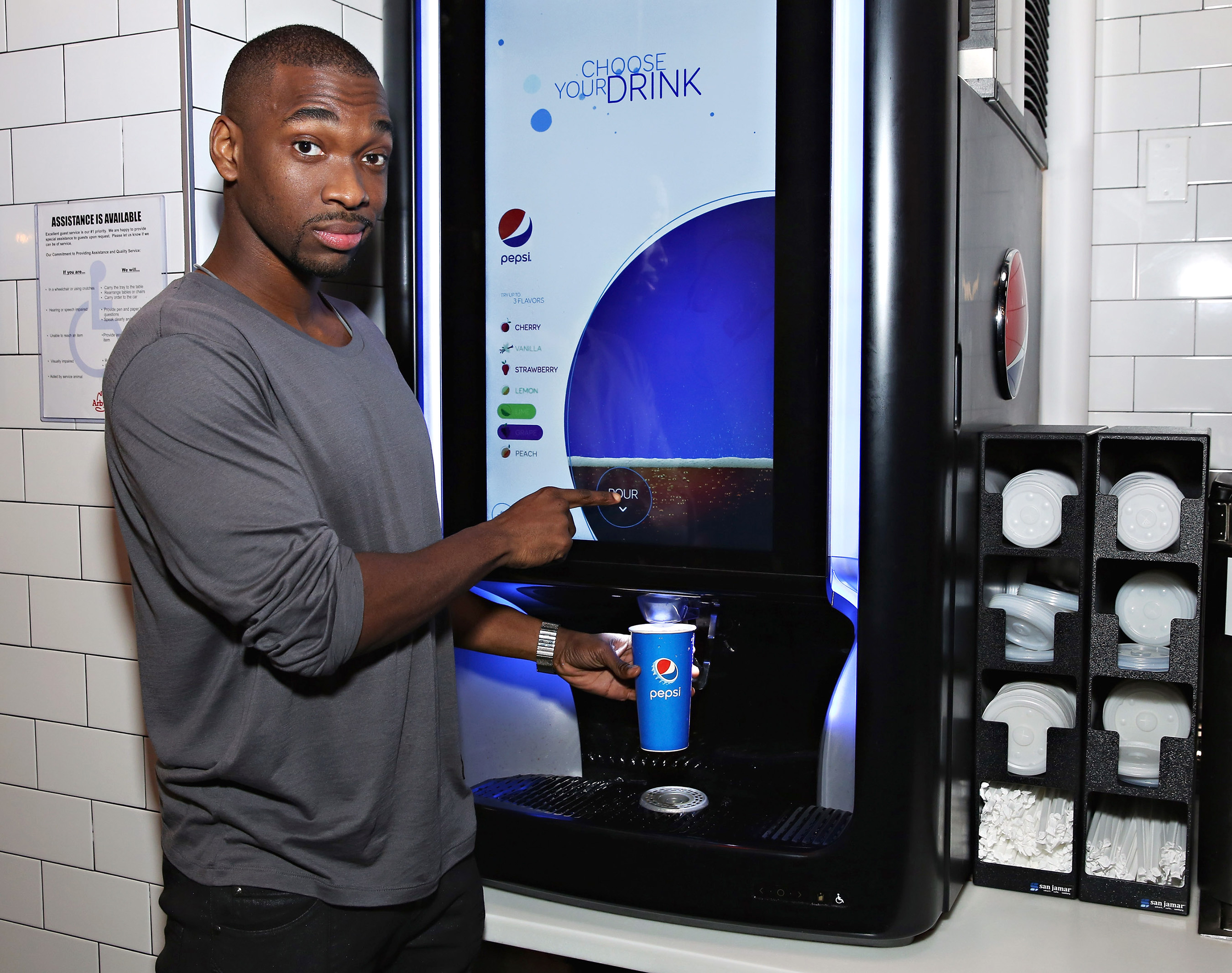Jay Pharoah shows fans how to raise the flavor of their favorite drink with Pepsi Spire, a high-tech digital soda foundation. Cindy Ord/Getty Images for Pepsi.