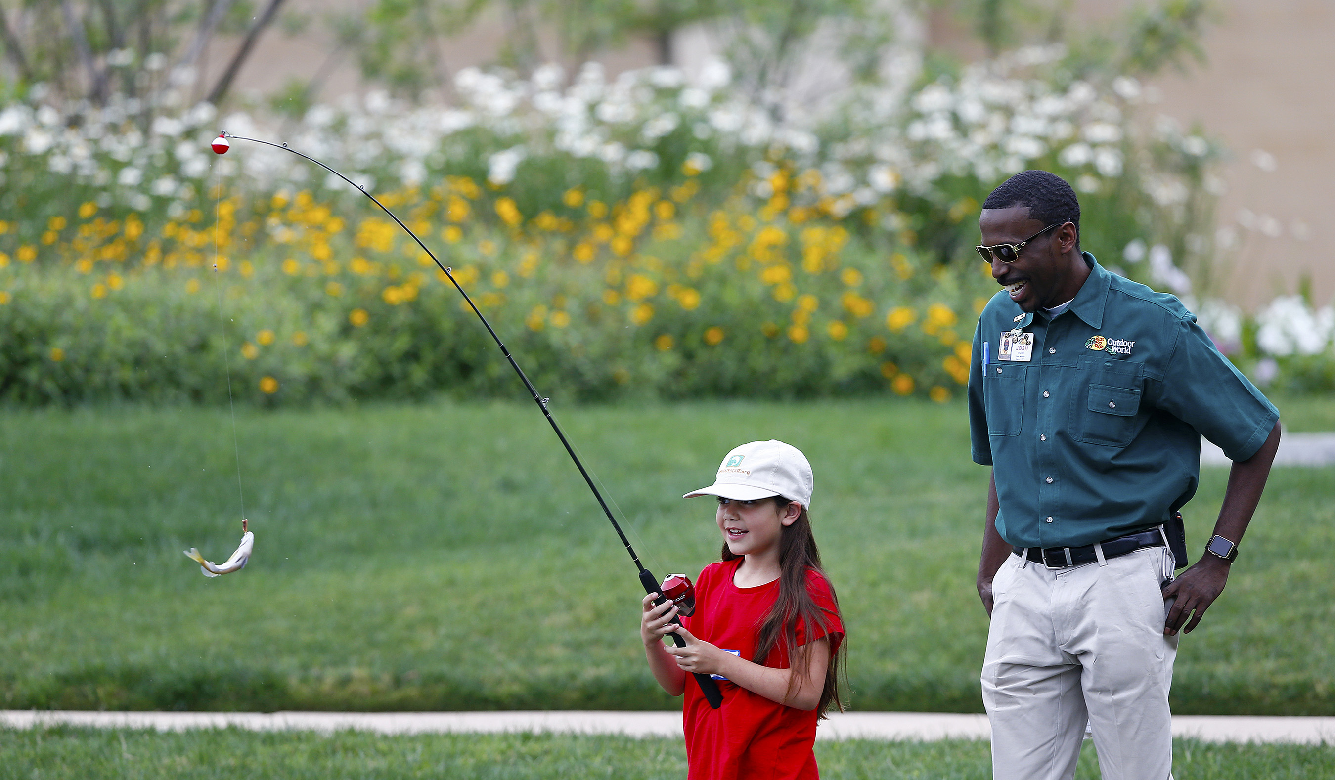 A child catches a fish during a Recreational Boating & Fishing Foundation (RBFF) event at the George Bush Presidential Library on Thursday, April 14, 2016, in College Station, Texas. RBFF is a nonprofit organization whose mission is to increase participation in recreational angling and boating, thereby protecting and restoring the nation’s aquatic natural resources. (Aaron M. Sprecher/AP Images for RBFF)