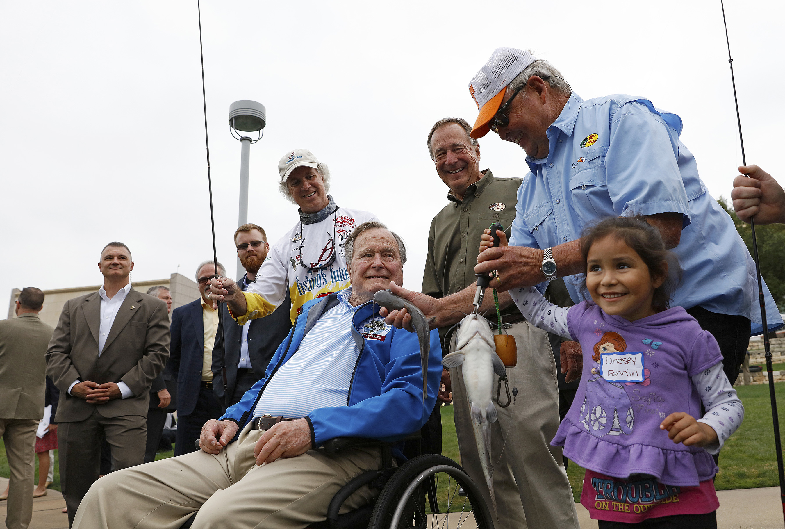President George H.W. Bush, center, fishes with local children during a Recreational Boating & Fishing Foundation (RBFF) event at the George Bush Presidential Library on Thursday, April 14, 2016, in College Station, Texas. RBFF is a nonprofit organization whose mission is to increase participation in recreational angling and boating, thereby protecting and restoring the nation’s aquatic natural resources. (Aaron M. Sprecher/AP Images for RBFF)