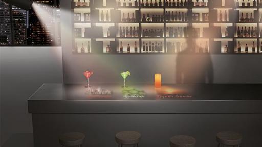 Cocktail bar with drinks on the table and silhouette of a person