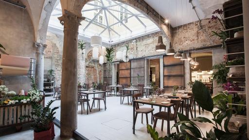 Rustic dining area with wooden tables and chairs