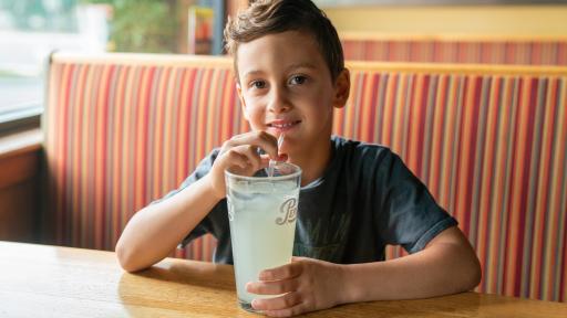 Boy drinking lemonade.