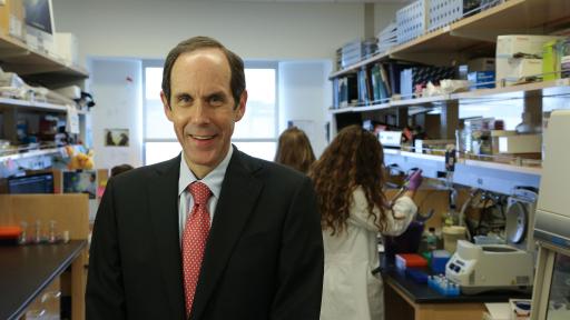 Profile of Brian Druker in his research facility.