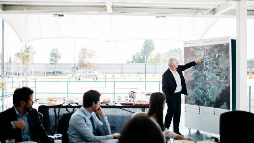 Exterior of an Amazon fulfillment center building at sunset.