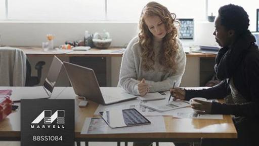 Woman and man sitting at a table.