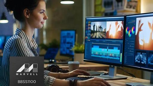 Woman at computer with two screens