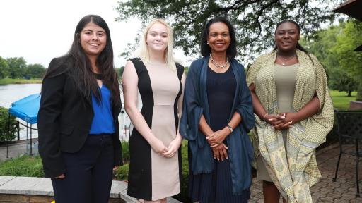 Dr. Condoleezza Rice poses with three representatives of the 2018 Future Leaders Class