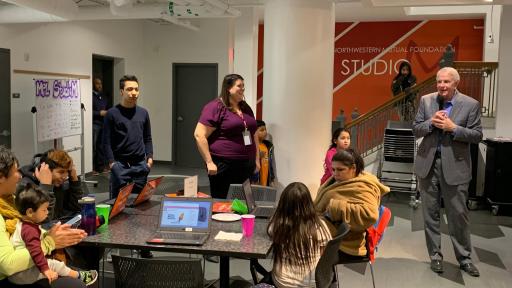 Students working with computers and robots