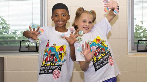 Boy and girl with stickers on each finger