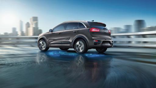 Sideview of the Kia Soul EV in a cityscape