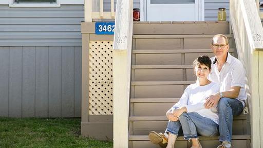Couple sitting on their front steps