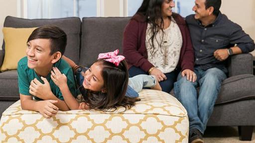 Family sitting on couch