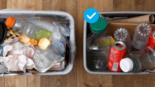 Two trash cans next two each other containing trash and recyclables