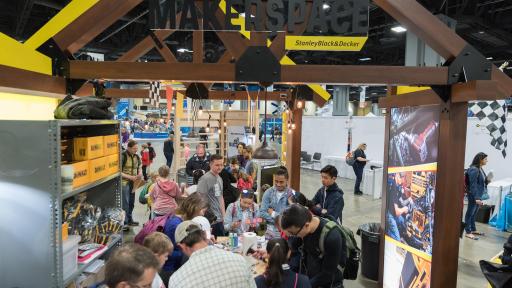 Group of people working at a table during a convention