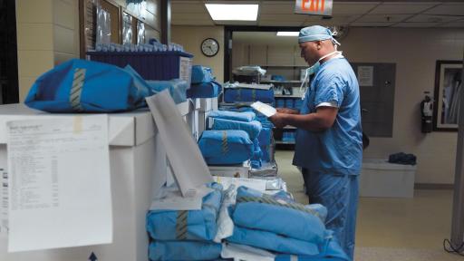 Doctor in scrubs filling medical orders