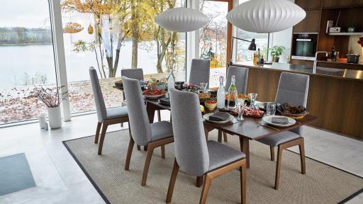 Walnut dining table and grey chairs