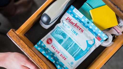 Plackers flossers stored in a drawer.