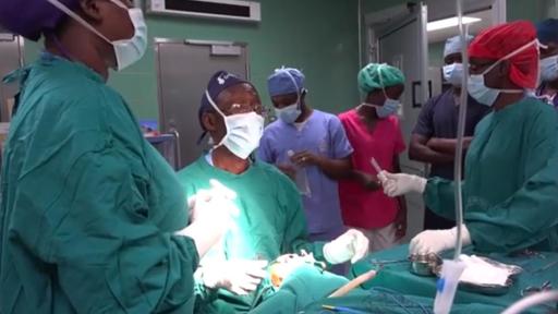 Doctor talking over surgery, in the operating room.