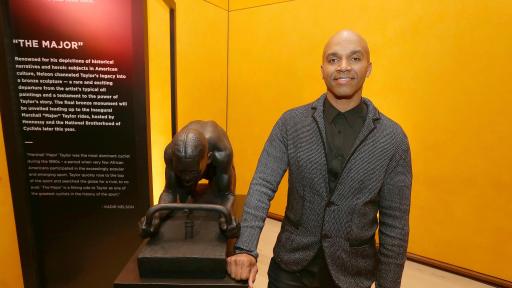 man standing next to a monument