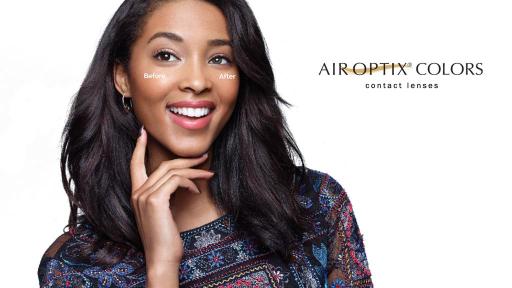 Woman smiling and wearing turquoise contact lenses.