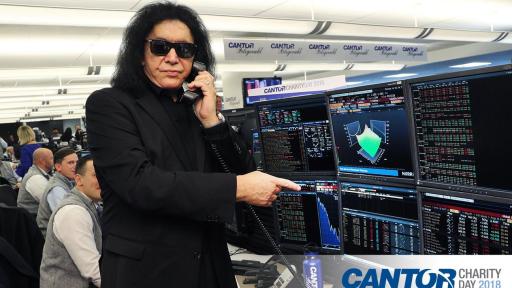Dressed in black Gene Simmons answers phones for Cantor fundraiser