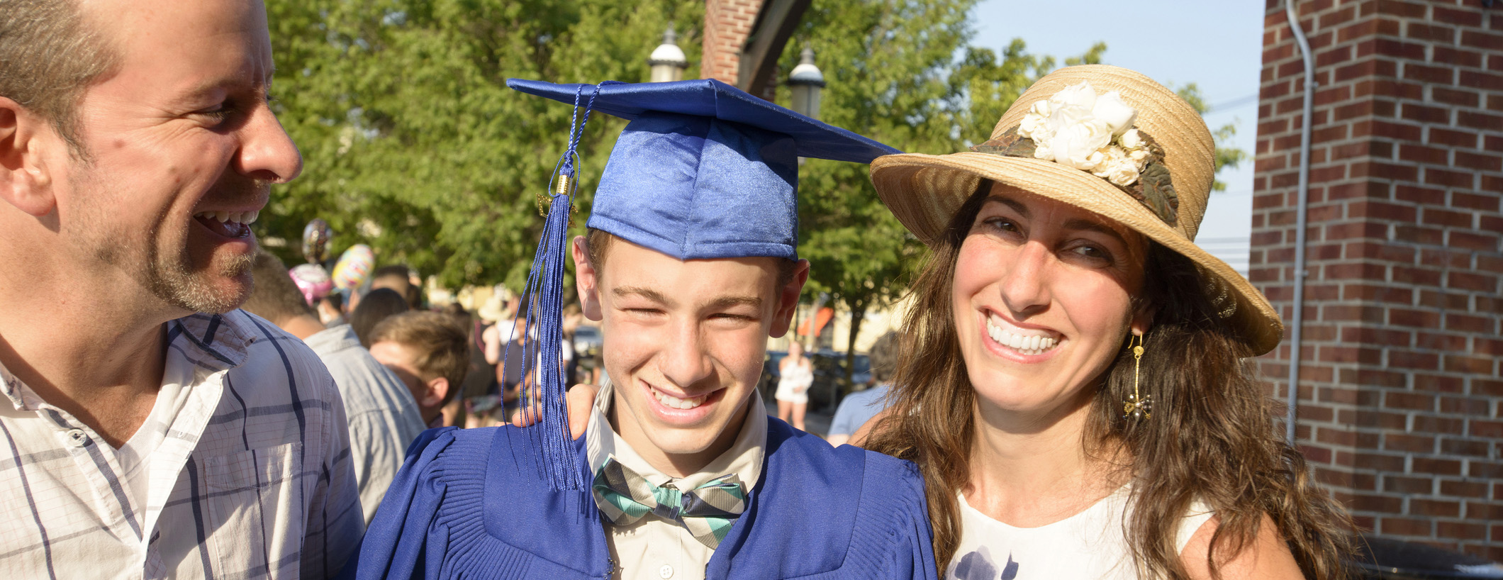 Parents with their son in his cap and gown