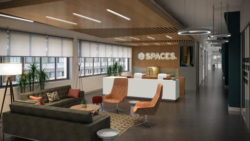 A lounge area with couches and chairs around a small and circular wooden table atop a rug.