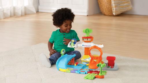 Young boy playing with the Go! Go! Smart Wheels Take Flight Airport