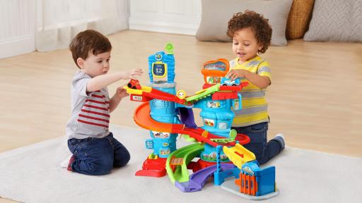 Two young boys playing with Launch & Chase Police Tower