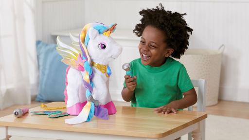 Boy singing and playing with Myla the Magical Unicorn